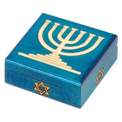 Menorah Polish Box. This box is decorated with a blue finish and a menorah outlined with metal inlay. A Star of David decorates the front of the box.