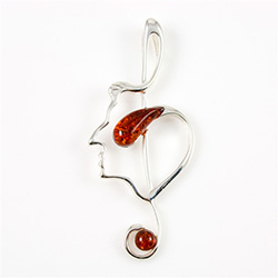 Hand made with Sterling Silver detail Amber. Use as a pendant or as a pin.