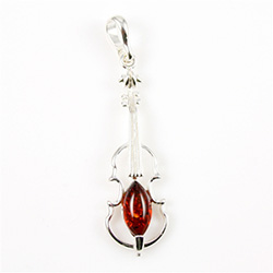 Baltic amber with sterling silver detail. Our musical instrument is approx 2" x .5".