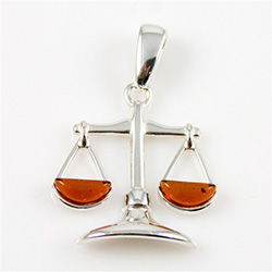 Hand made Cognac Amber Libra pendant with Sterling Silver detail.  September 23 - October 22