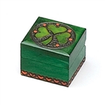A Bit More Luck Shamrock Polish Box. This Irish green box features a shamrock inside a metal inlaid circle with yellow circles for accent. Entire design is hand-carved.