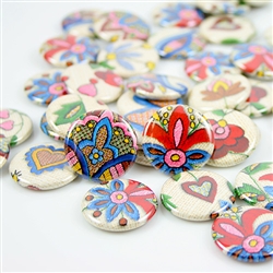 These small pinback buttons are bright and colorful, featuring traditional Polish Kashubian printed embroidery designs. We make these buttons in house, a Polish Art Center exclusive!