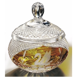 Amber colored cased crystal is a Polish specialty.  Hand blown, cut and polished from the "Julia" factory in Poland,  this beautiful covered candy dish features a swan on two sides. Beautiful etching.