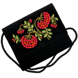 Hand embroidered shoulder purse made from velvet.  Fully lined.  Extra long strap (extends to approx 30"). Snap closure.  Made in Lowicz, Poland.