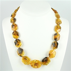 This beaded Amber necklace features shades of yellow, green Amber