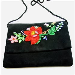 Hand beaded shoulder purse made from velvet.  Fully lined.  Extra long strap (extends to 30"). Snap closure.  Made in Lowicz, Poland.  Flower colors and design vary slightly from purse to purse.