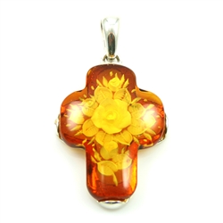 Beautiful floral bouquet cameo carved into the back of this amber cross set in a sterling silver frame.