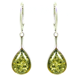 Artistic tear drop shaped silver earrings with a center of green colored amber.