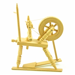 Miniature wooden spinning wheel.  Wheel and spindle turn.  Hand made in Poland.