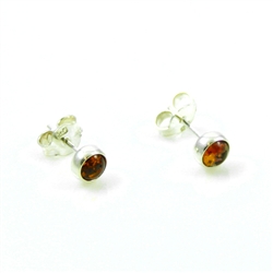 Baltic Amber stud earrings with sterling silver detail.  Size is approx 5mm diameter.