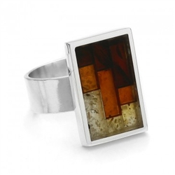 Sterling silver adjustable ring inlaid with multi-color mosaic amber. The process to create this amber mosaic is quite unique. See the video below.