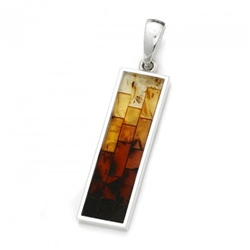 Stunning pendant with multi-color mosaic amber. The process to create this amber mosaic is quite unique. See the video below.