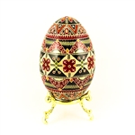 This beautifully designed and executed turkey egg is hand painted by our artist from Canada using the traditional batik method. The egg has been emptied through two small holes at each end of the egg. Stand sold separately.