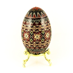 This beautifully designed and executed turkey egg is hand painted by our artist from Canada using the traditional batik method. The egg has been emptied through two small holes at each end of the egg. Stand sold separately.