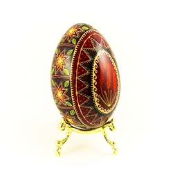 This beautifully designed and executed turkey egg is hand painted by our artist from Canada using the traditional batik method. The egg has been emptied through two small holes at each end of the egg. Stand sold separately.