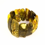 Multi-colored amber cuff bracelet.  Made in Lithuania this gorgeous bracelet features raw semi-polish amber which highlights the natural beauty of the stones.