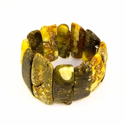 Multi-colored amber cuff bracelet.  Made in Lithuania this gorgeous bracelet features raw semi-polish amber which highlights the natural beauty of the stones.