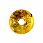 Very impressive polished doughnut shaped honey amber stone for pendant use. Weighs 5.5g.  This amber stone is mainly polished but also has natural rough spots to highlight its natural origins.