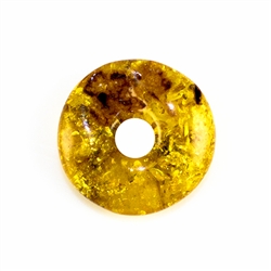 Very impressive polished doughnut shaped honey amber stone for pendant use. Weighs 5.5g.  This amber stone is mainly polished but also has natural rough spots to highlight its natural origins.