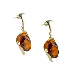 Stunning silver design holds and equally stunning marquis cut cognac amber cabochon.