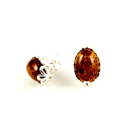Open back oval amber earrings set in a sterling silver frame really highlight the amber inclusions.