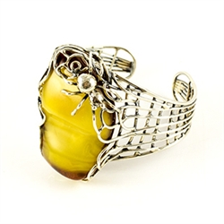 Antiqued silver surrounds this stunning amber nugget (1.25" x 2" x .5" - 3cm x 5cm x 1.2cm).