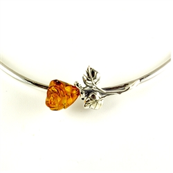 Hand carved amber rose is the centerpiece of this beautiful adjustable silver collar.