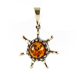 Beautiful honey amber sphere suspended by a sterling silver attachment.