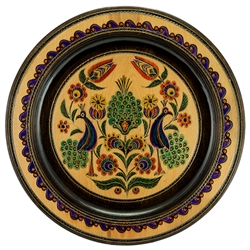 Hand Made in Southern Poland. This Polish plate is made from beech wood in the mountain region of southern Poland called Podhale. The plates are cut and shaped on a lathe by hand. The floral designs are burned into the wood then painted after staining and