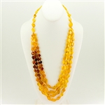 Bozena Przytocka is a designer of artistic amber jewelry based in Gdansk, Poland. Here is a beautiful example of her ability to blend multiple shades of amber to create a stunning necklace.