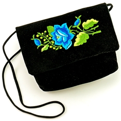 Hand embroidered clutch purse made from velvet. Fully lined. 17" long strap.  Snap closure. Made in Lowicz, Poland.