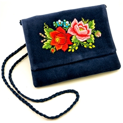 Hand embroidered clutch purse made from velvet. Fully lined. Extra long strap (extends to 25"). Snap closure. Made in Lowicz, Poland. Flower colors and design vary slightly from purse to purse.