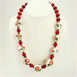 Beautiful mountain folk necklace made with natural looking coral like beads and decoupaged wooden beads featuring folk flowers. Adjustable metal clasp. Maximum length 24" - 61cm. Made In Zakopane, Poland.