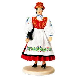 Our young lady is dressed in a Kaszub outfit reserved for special ceremonies. This costume can come in either red or green. The Kaszub region is located in northern Poland.  You can learn more about this region here:  http://en.wikipedia.org/wiki/Kashubia