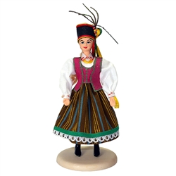 Our young lady is dressed in the costume from Kurpie.  The Kurpie region is located in Poland on a lowland plain called the Mazovian Region (Mazowsze), which was once covered over by two forests known as the Puszcza Zielona (the Green Wilderness) and the