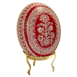 This beautifully designed egg is dyed one color, then white wax is melted and applied to form an intricate design which is left on the surface. The egg is emptied through one hole in the bottom.