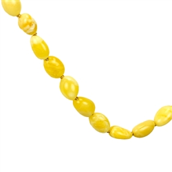 This beautiful beaded amber necklace features small oval shaped Baltic custard color amber beads strung together, and finished with an amber closure. The beads are knotted between each bead.