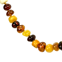 Lovely necklace composed of cherry, custard, light and dark honey amber. Oval amber bead size approx 6mm and smaller.  Gold colored cord w/ knot between each bead.  Gold plated silver claw clasp closure.
