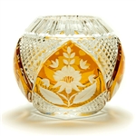 This is genuine Polish hand-cut leaded crystal with a floral design.  Amber colored background.