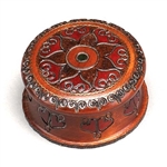 Handcarved and brass inlaid swirls create a flower-like pattern. Sides are carved as well.