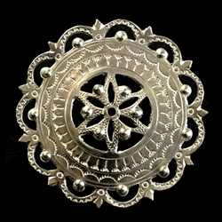 This Highlander pin is normally worn in the center of the man's shirt. Hand worked from metal with intricate detailing by one master artisan in Bukowina near Zakopane. The workmanship is exquisite and the detail so rich these decorations have become co