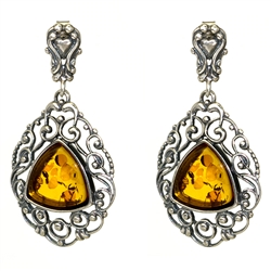 Triangular shaped honey amber inside an ornate Sterling Silver filigree design. Stylish and unique earrings.