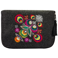 The IPad cover is made of stiff dark grey felt. The main decoration is vivid embroidery - Lowicz Flowers (made by Farbotka brand). Quilted lining and pocket inside. Cover is fastened with a zipper. Finished with a tassel.  Interior brand logo is slightly