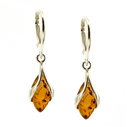 Honey amber wrapped in Sterling Silver teardrops. Stylish and unique.Amber is soft, only slightly harder than talc, and should be treated with care.