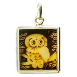 Beautifully carved owl in rectangular shaped amber pendant framed in sterling silver. Size approx. .8" x 1.25" - 2.3cm x 3.5cm (including finding.
