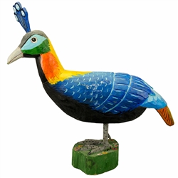 Peacocks are quite popular in Poland and their feather was the original theme for stoneware designs. Carved and painted by folk artist Zbigniew. Suchinski. Please note that the head and body are composed of two pieces of wood and are joined at the neck.