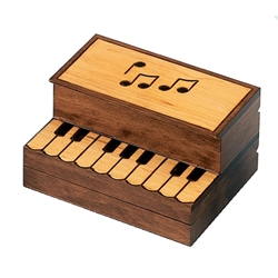Burned and stained piano design, upright musical notes area opens and below the keys this box opens for 2 compartments.