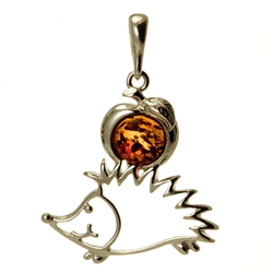 Hand made with Sterling Silver detail.  Our cute little silver hedgehog is making off with an Amber apple!