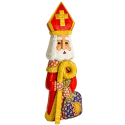 This St. NIcholas was carved and painted by Polish folk artist Andrzej Cichon from Kutno. Mr Cichon signs his work by carving a stylized version of his initials on the bottom of this carving. The body is carved from one block of wood (approx 15.5" x 5.5"