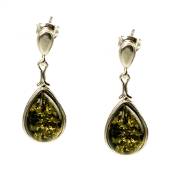 Artistic tear drop shaped silver earrings with a center of green colored amber.